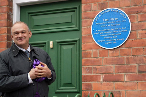 Ed Davey next to a blue plaque for Sam Green