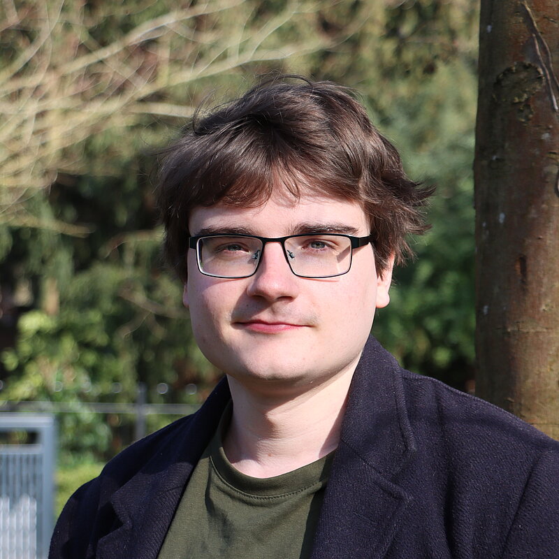 James standing in a park